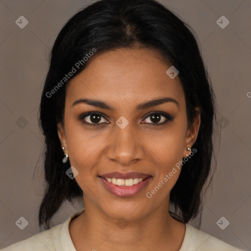 Joyful black young-adult female with medium  black hair and brown eyes