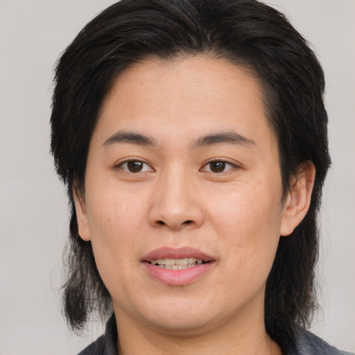 Joyful asian young-adult female with medium  brown hair and brown eyes