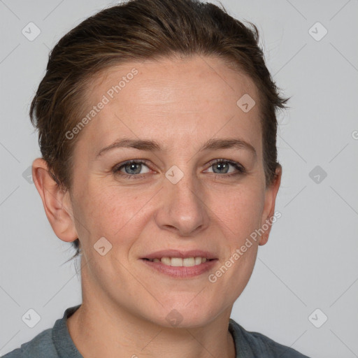 Joyful white adult female with short  brown hair and grey eyes