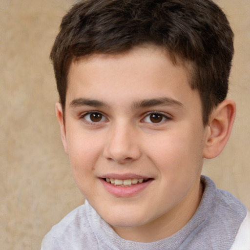 Joyful white child male with short  brown hair and brown eyes