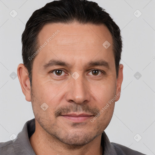 Joyful white adult male with short  brown hair and brown eyes