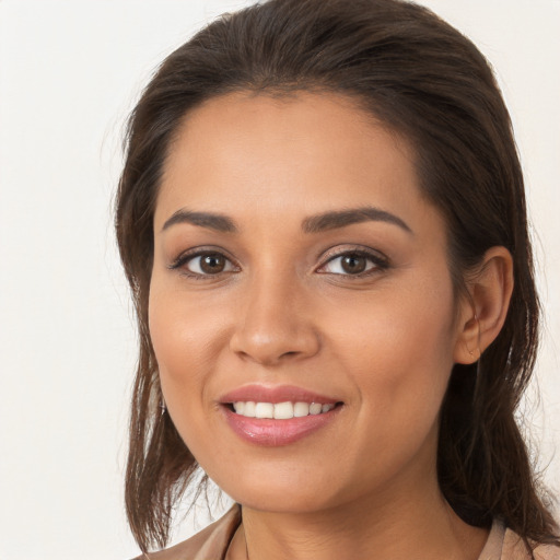 Joyful white young-adult female with medium  brown hair and brown eyes