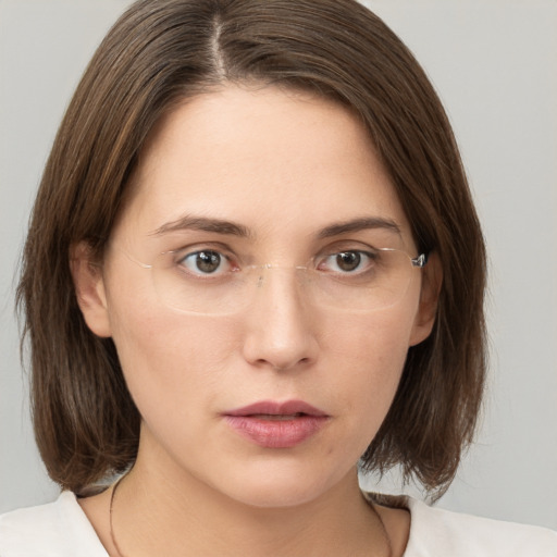 Neutral white young-adult female with medium  brown hair and brown eyes