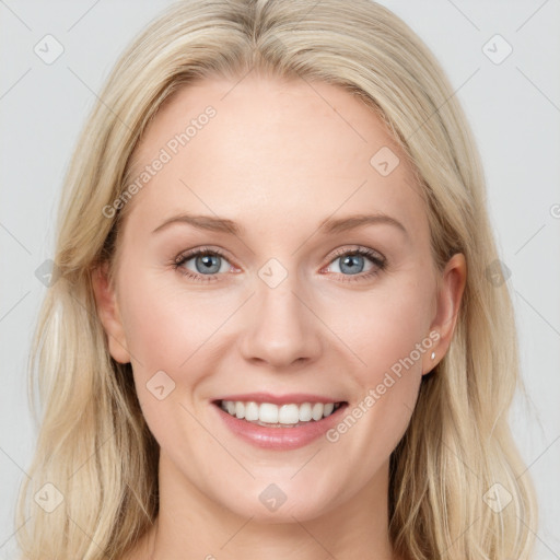 Joyful white young-adult female with long  brown hair and blue eyes