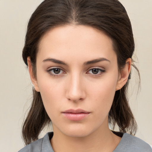 Neutral white young-adult female with medium  brown hair and brown eyes