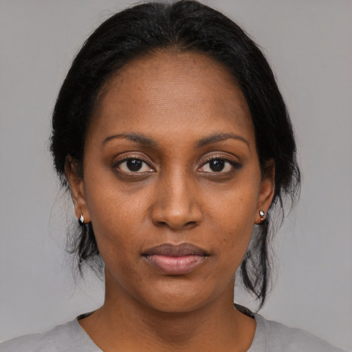 Neutral black young-adult female with medium  black hair and brown eyes