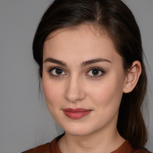 Joyful white young-adult female with medium  brown hair and brown eyes