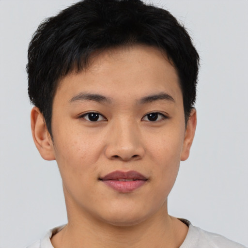 Joyful asian young-adult male with short  black hair and brown eyes