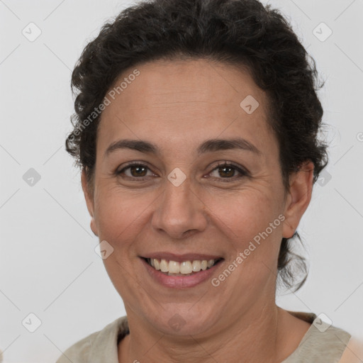 Joyful white adult female with short  brown hair and brown eyes