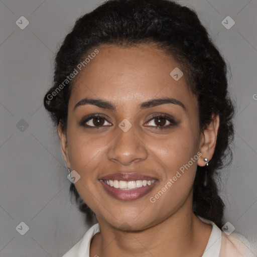 Joyful black young-adult female with medium  brown hair and brown eyes