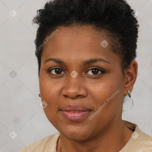 Joyful black young-adult female with short  brown hair and brown eyes