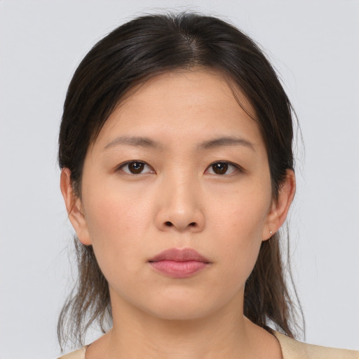Neutral asian young-adult female with medium  brown hair and brown eyes