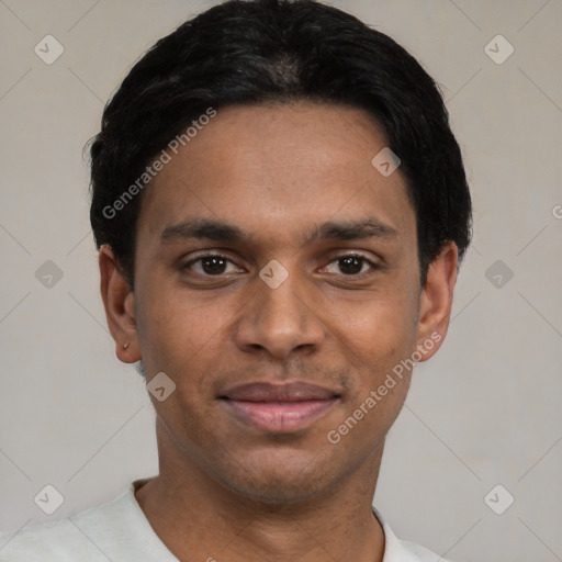 Joyful black young-adult male with short  black hair and brown eyes