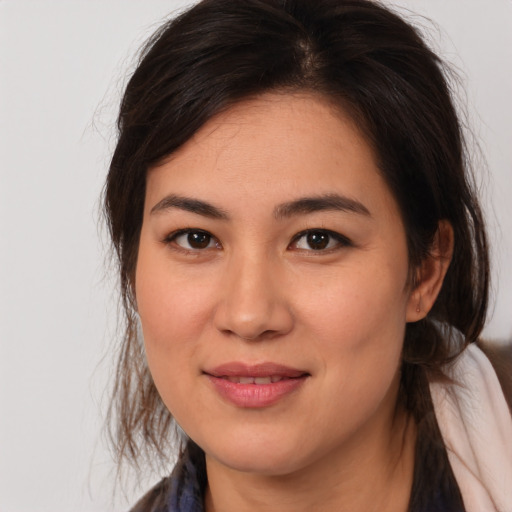 Joyful white young-adult female with medium  brown hair and brown eyes