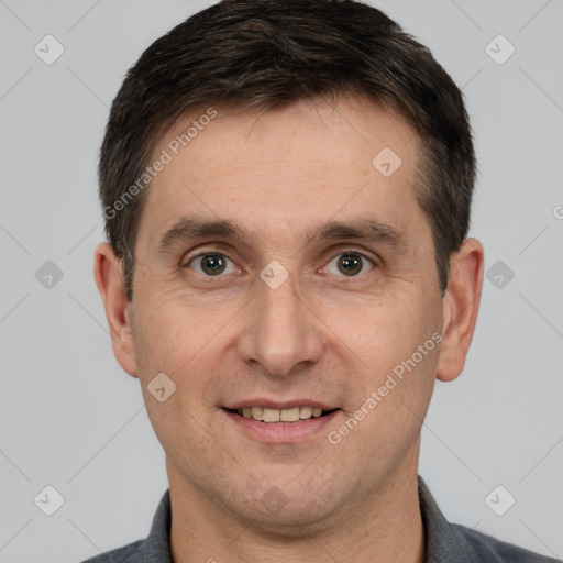 Joyful white adult male with short  brown hair and brown eyes