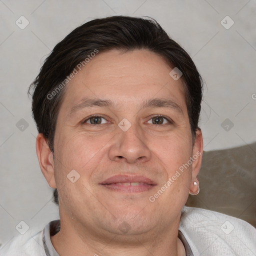 Joyful white adult male with short  brown hair and brown eyes