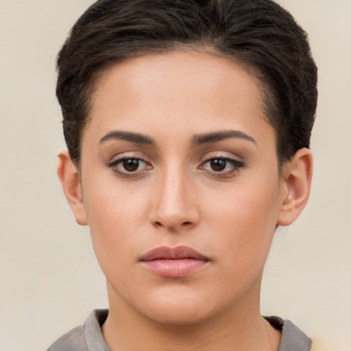 Neutral white young-adult female with short  brown hair and brown eyes