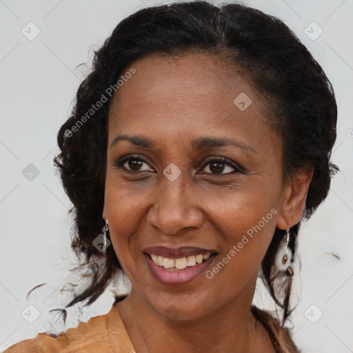 Joyful black adult female with medium  brown hair and brown eyes