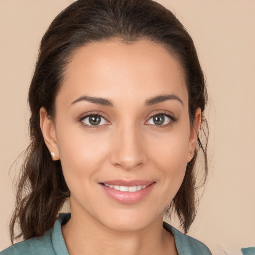 Joyful white young-adult female with medium  brown hair and brown eyes