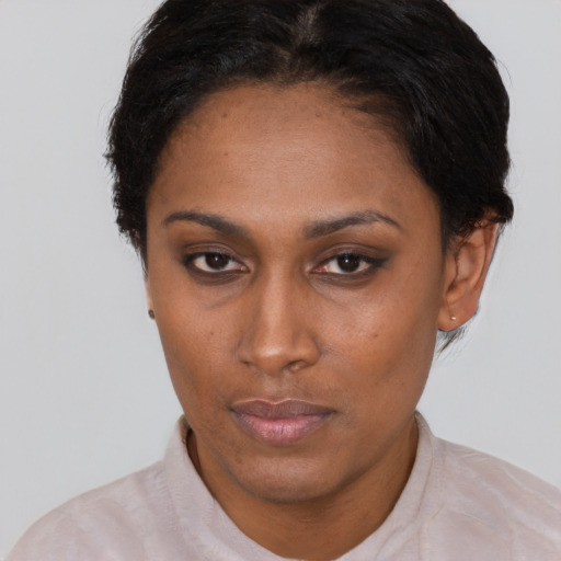 Neutral latino young-adult female with short  brown hair and brown eyes