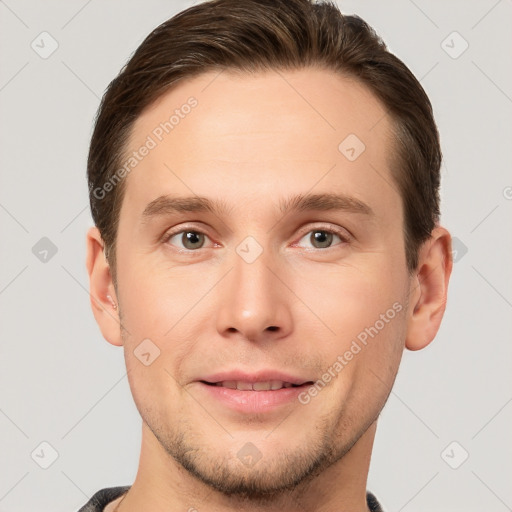 Joyful white young-adult male with short  brown hair and grey eyes