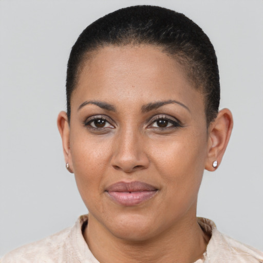 Joyful latino young-adult female with short  brown hair and brown eyes