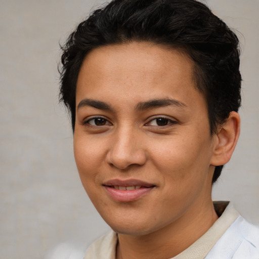 Joyful latino young-adult female with short  brown hair and brown eyes