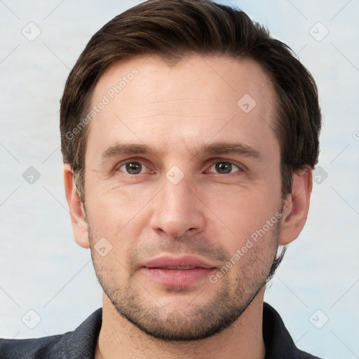 Joyful white young-adult male with short  brown hair and grey eyes