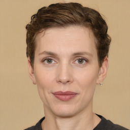 Joyful white adult female with short  brown hair and brown eyes