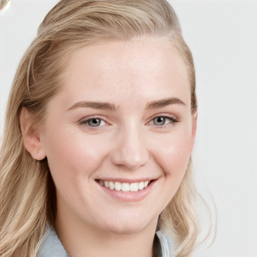 Joyful white young-adult female with long  brown hair and blue eyes