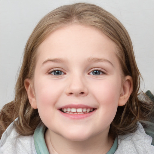 Joyful white child female with medium  brown hair and blue eyes