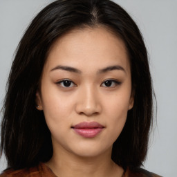 Joyful asian young-adult female with long  brown hair and brown eyes