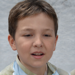 Joyful white child male with short  brown hair and brown eyes