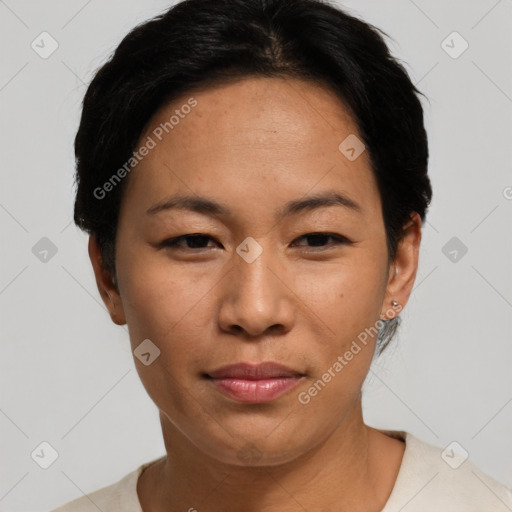 Joyful asian adult female with short  black hair and brown eyes