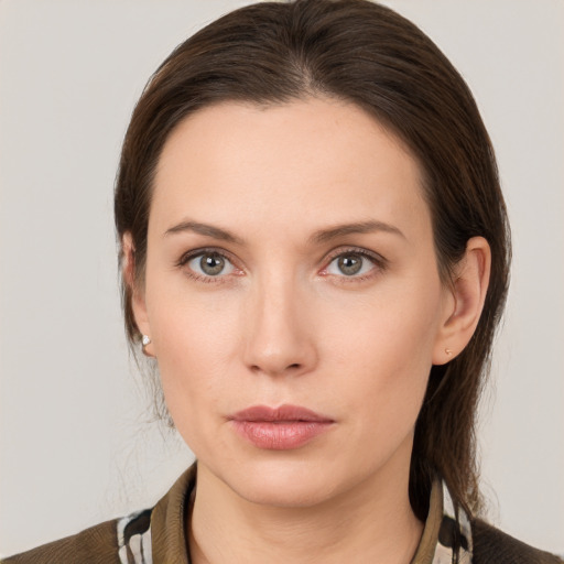 Neutral white young-adult female with medium  brown hair and grey eyes