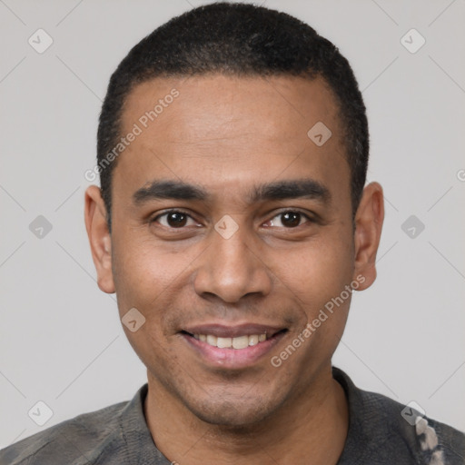 Joyful latino young-adult male with short  black hair and brown eyes