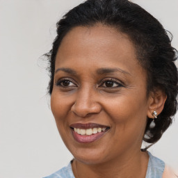 Joyful black young-adult female with medium  brown hair and brown eyes