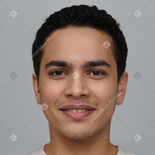 Joyful latino young-adult male with short  black hair and brown eyes