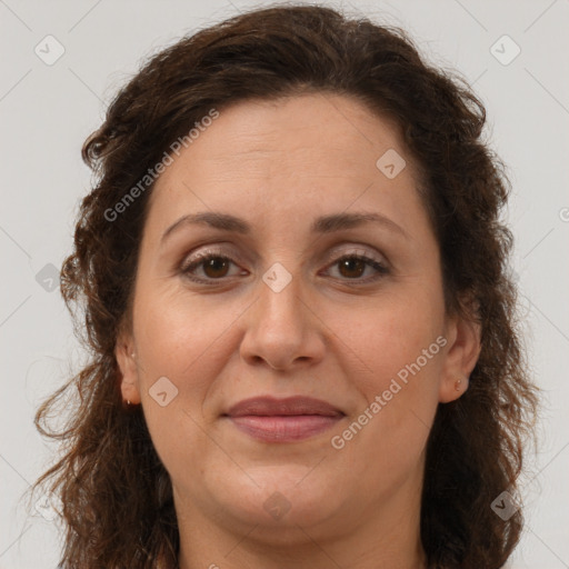 Joyful white adult female with long  brown hair and brown eyes