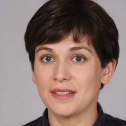 Joyful white adult female with short  brown hair and brown eyes