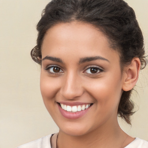 Joyful white young-adult female with medium  brown hair and brown eyes