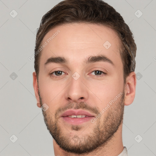 Joyful white young-adult male with short  brown hair and brown eyes