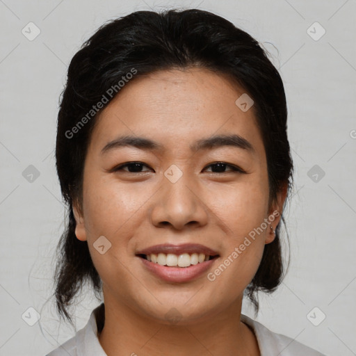 Joyful asian young-adult female with medium  black hair and brown eyes