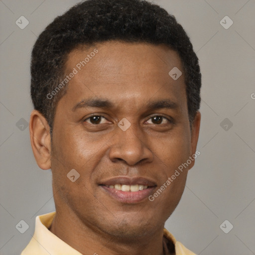 Joyful black young-adult male with short  brown hair and brown eyes