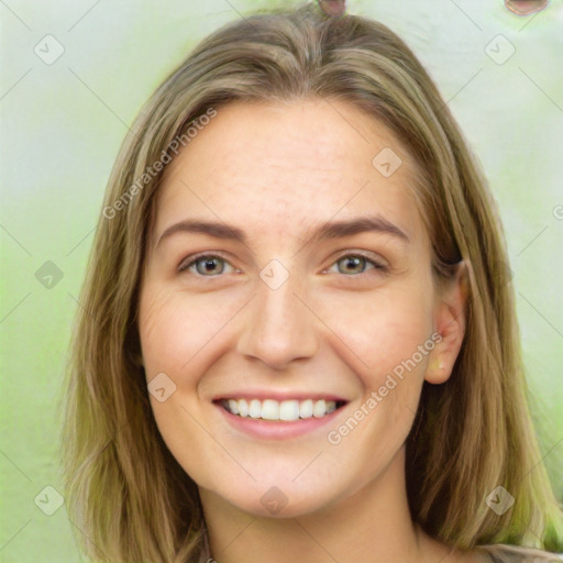 Joyful white young-adult female with long  brown hair and green eyes