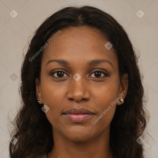 Joyful black young-adult female with long  brown hair and brown eyes