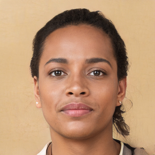 Neutral black young-adult female with short  brown hair and brown eyes