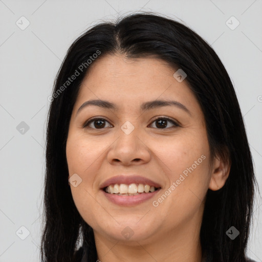 Joyful asian young-adult female with long  brown hair and brown eyes