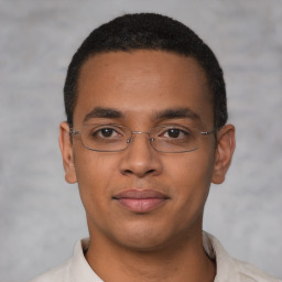 Joyful latino young-adult male with short  brown hair and brown eyes