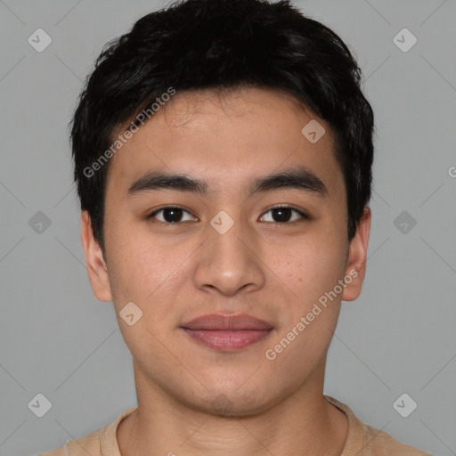 Joyful asian young-adult male with short  black hair and brown eyes